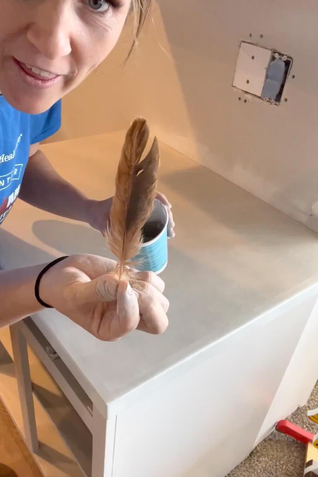 Painting a countertop for a faux marble finish. 